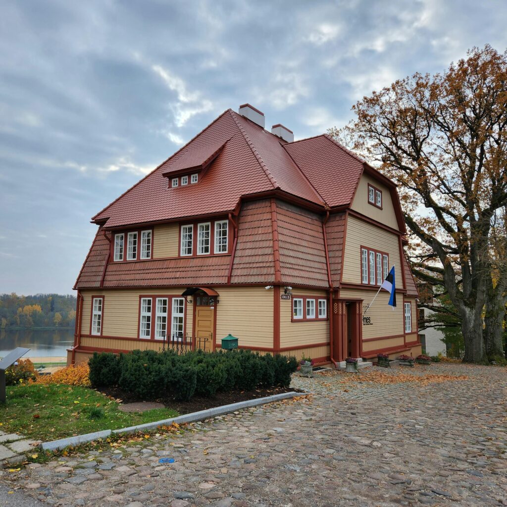 Beautiful autumn view of a traditional villa by the lake in Viljandi, Estonia.